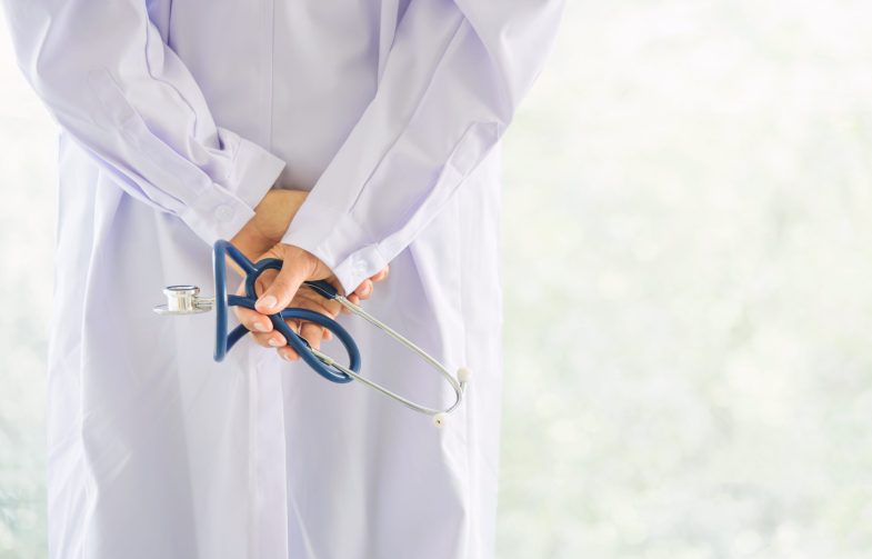 back view of doctor hand hold stethoscope with blur background back view of doctor hand hold stethoscope with blur background and copy space